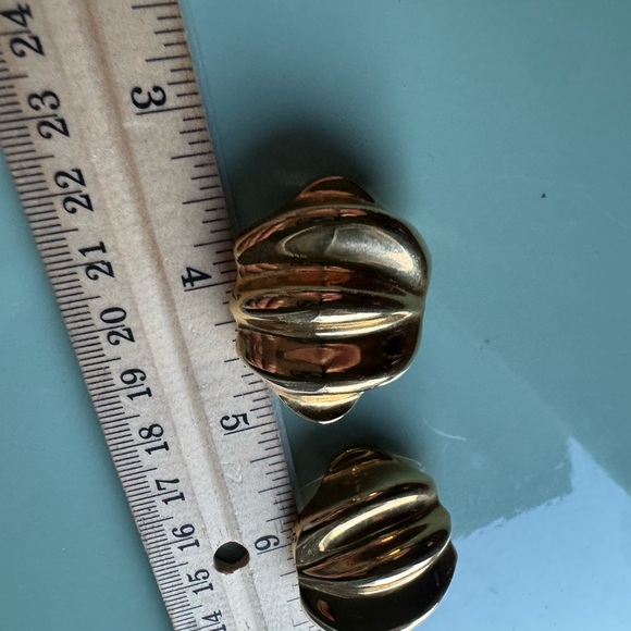 Large gold tone clip on vintage earrings